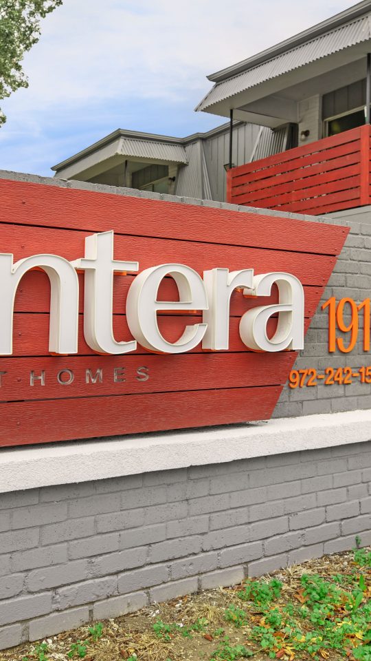 the sign for cantera apartments in austin, texas at The Cantera Apartment Homes